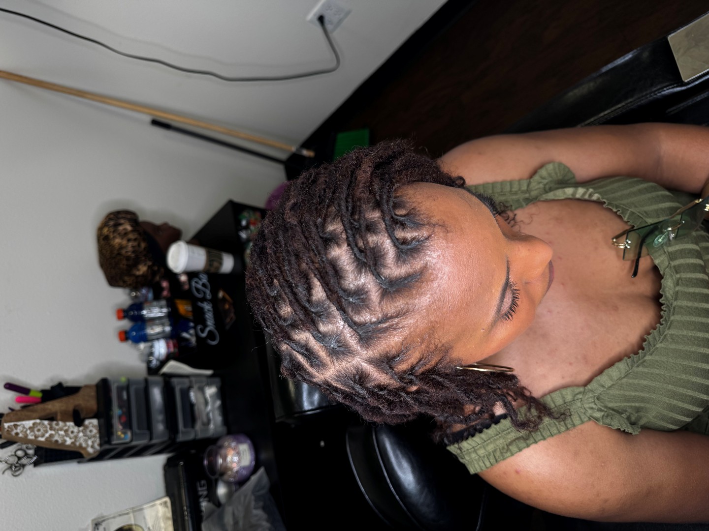 black woman after starting the loc installation